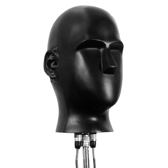 A Neumann KU 80 binaural microphone next to a later KU 100 model. Both resemble a human head with anatomically accurate ears and basic facial features. Source: Neumann site